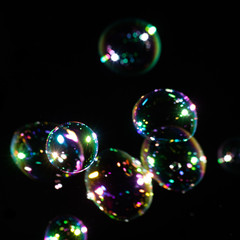 Squared background with transparent colorful soap bubbles