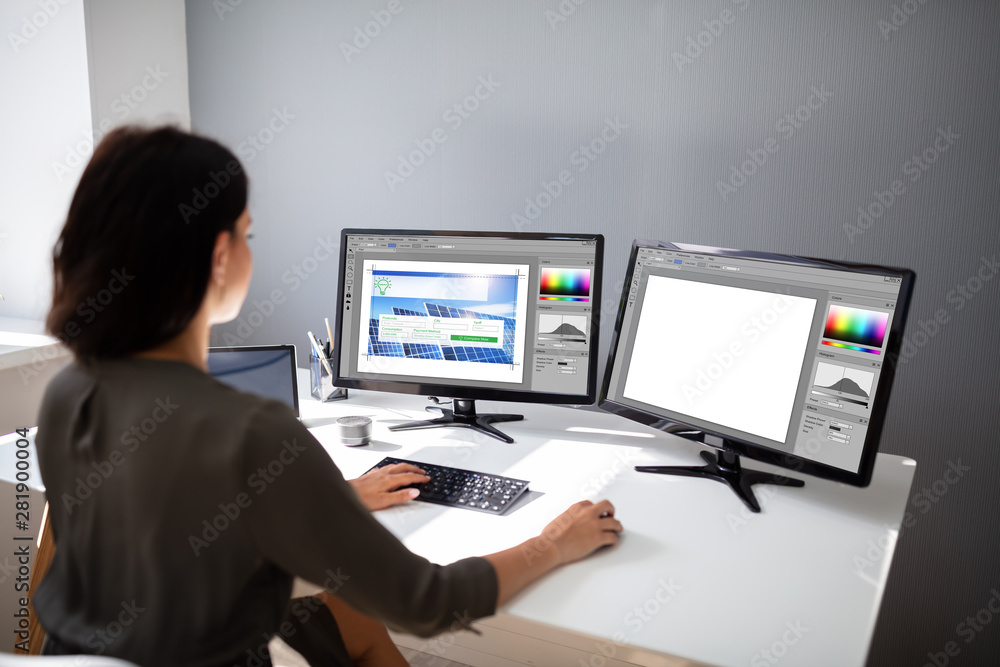 Poster designer woman working on computer in the office