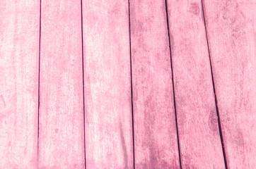 Pink wood floor with blurred pattern background
