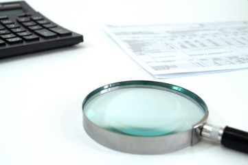 magnifier and coins