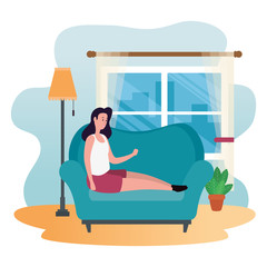 young and beautiful woman seated in sofa