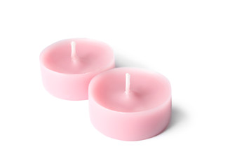 Obraz na płótnie Canvas Small pink wax candles isolated on white
