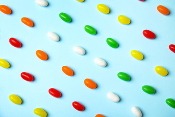 Flat lay composition with jelly beans on color background