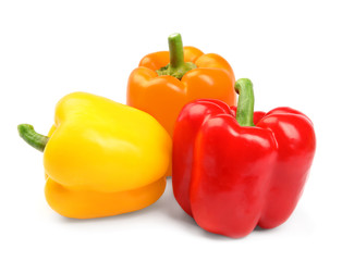 Fresh ripe bell peppers on white background