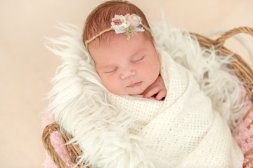 newborn girl sleeping sweetly