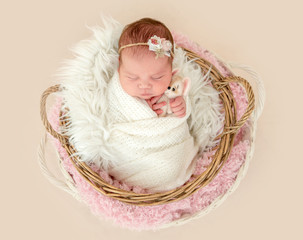 newborn girl sleeping sweetly