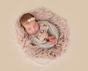 newborn girl sleeping sweetly
