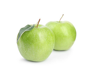 Fresh ripe green apples with leaf on white background