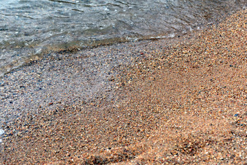 Sea water and beach sand close-up. Natural background