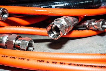 detail view of the connecting bolt of the industrial flexible orange tubes for water and high...