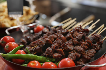 Delicious grilled meat served on table, closeup view