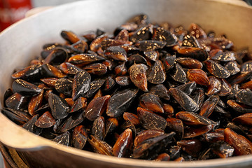 Many delicious fresh mussels in pan, closeup