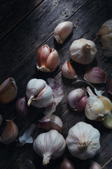 Garlic bulb and clove on rustic wooden
