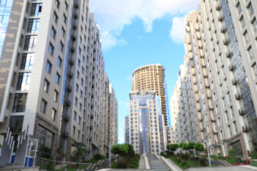 Fototapeta premium Blurred view of modern buildings in city