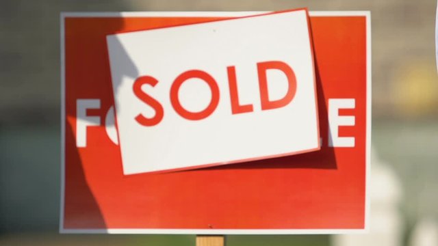 Real estate broker giving house key and shaking hands, sale agreement approval
