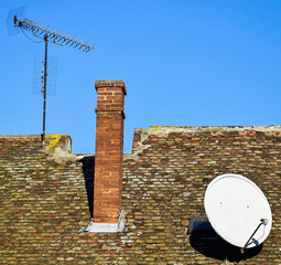 Antennas on the roof of an old building