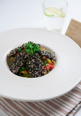 Tagliatelle pasta with sliced tuna steak fried in sesame seeds