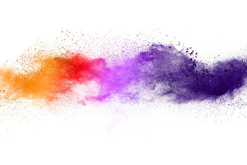 Freeze motion of colorful color powder exploding on white background.  Paint Holi.