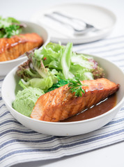 Salmon fish steak grilled and fresh vegetable salad