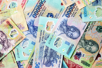 Various Vietnamese dong banknotes close-up. Money background