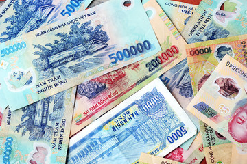 Various Vietnamese dong banknotes close-up. Money background