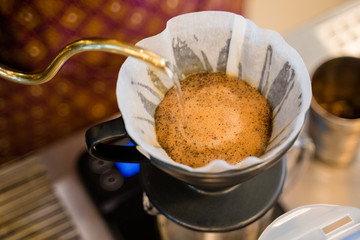 Pouring the hot water for dripping the coffee