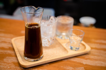 Hot dripped coffee served with a glass of ice