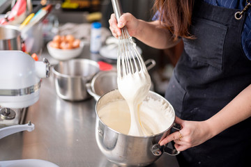 Beautiful woman is making bakery