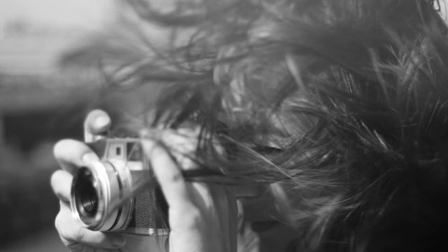 Young woman takes photos - sensual slow motion shot