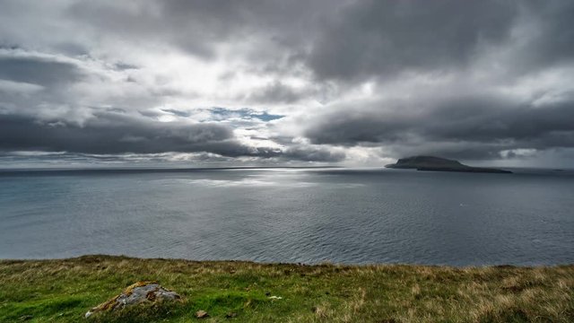 Time lapse of ocean and islands with stormy clouds