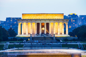 Lincoln memorial reflected on the reflection pool when dusk at nation mall, Washington DC, USA.