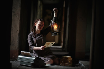 A girl with old books in the old house