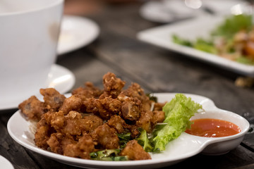 Deep fried chicken tendons with chili sauce