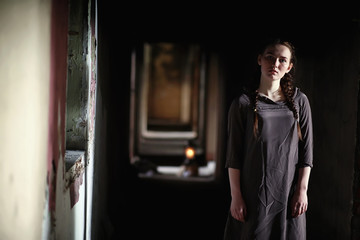 A girl with old books in the old house