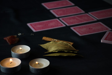  A session of fortune telling on cards, looking into the future, laying out cards for the past, present and future on cards