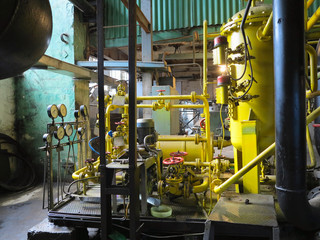 Industrial big water pumps with electric motors, pipes, tubes, equipment and steam turbine at power plant