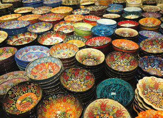 Fototapeta premium Handcrafted colorful decorated plates shot at the market