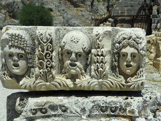 Bas-relief and stone sculpture of ancient Roman theater masks