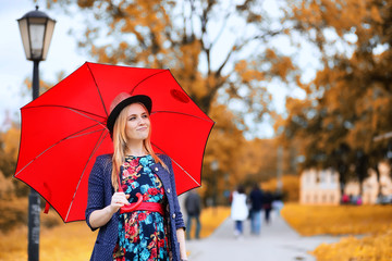 Girl in the street with an umbrella