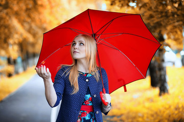 Girl in the street with an umbrella