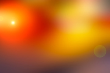Abstract blurred background and light flash of light. Pink, yellow and orange spot.