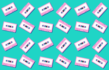 Seamless pattern with vintage pink audio tape cassette concept illustration isolated on green background, 3d rendering