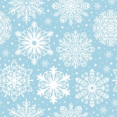 Seamless pattern with white snowflakes on blue background. Winter background for Christmas, Noel, New Year.