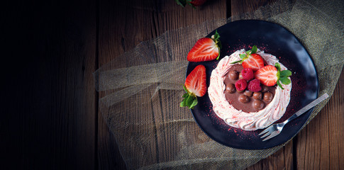 light pavlova with fresh fruits and chocolate
