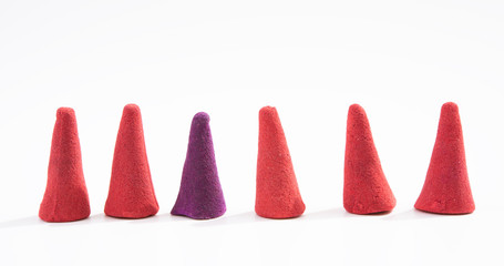 Think different concept,colourful incense isolated on white background