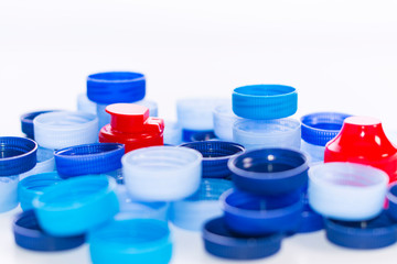 Plastic caps on white background