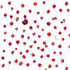 Scattered strawberry isolated on white. Organic berry