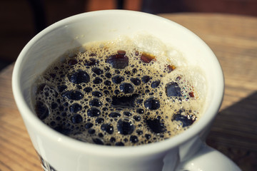 Black Coffee Bubble on the morning with sunlight