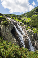 Mountain waterfall Siklawa in Polish Tatra Mountains. Tatra National Park