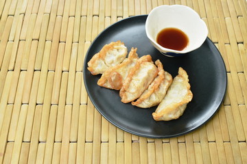 deep fried chop fish with slice ginger and celery on plate